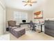 Comfortable bedroom with a vaulted ceiling, shutters, and a cozy chair with ottoman at 3564 Brampton Dr., Myrtle Beach, SC 29588