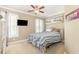Cozy bedroom featuring plantation shutters, ceiling fan, and carpeted floors at 3564 Brampton Dr., Myrtle Beach, SC 29588
