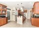 Spacious kitchen with stainless steel appliances, custom cabinets, and a center island, perfect for cooking and entertaining at 3564 Brampton Dr., Myrtle Beach, SC 29588