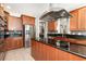 Gourmet kitchen with granite counters, stainless steel appliances, and custom cabinetry offers an elegant space to cook at 3564 Brampton Dr., Myrtle Beach, SC 29588