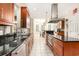 Open kitchen with granite countertops, tile backsplash, stainless appliances, and breakfast nook that brings in ample light at 3564 Brampton Dr., Myrtle Beach, SC 29588