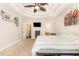 Spacious main bedroom featuring a tray ceiling with fan, carpet floors, and ensuite bathroom access at 3564 Brampton Dr., Myrtle Beach, SC 29588