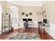 Bright home office with hardwood flooring, and built-in shelving that provides a functional workspace at 3564 Brampton Dr., Myrtle Beach, SC 29588