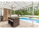 Backyard with a covered dining area, BBQ, and a pool offering a great outdoor retreat at 3564 Brampton Dr., Myrtle Beach, SC 29588