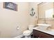 Stylish powder room featuring a unique vanity, decorative mirror, and fixtures adding a touch of elegance at 3564 Brampton Dr., Myrtle Beach, SC 29588