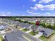 Aerial view of new home construction neighborhood with manicured lawns and sidewalks on a sunny day at 367 Broughton Dr., Myrtle Beach, SC 29579