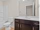 Clean bathroom featuring a vanity with dark wood cabinets and a white countertop, plus a toilet and tub at 367 Broughton Dr., Myrtle Beach, SC 29579