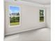 Bright bedroom features large windows with serene backyard views at 367 Broughton Dr., Myrtle Beach, SC 29579