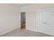 Neutral bedroom featuring carpet floors, closet, and an open door to another space with light hard wood floors at 367 Broughton Dr., Myrtle Beach, SC 29579