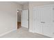 Bedroom featuring carpet, double closet and an opened doorway into another room at 367 Broughton Dr., Myrtle Beach, SC 29579