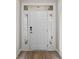 Bright front door with sidelights and a transom window, set against neutral walls at 367 Broughton Dr., Myrtle Beach, SC 29579