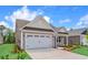 Inviting home exterior featuring a two-car garage, driveway, and manicured front lawn at 367 Broughton Dr., Myrtle Beach, SC 29579