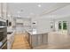 Bright, modern kitchen features stainless appliances, large island with sink, and ample cabinets at 367 Broughton Dr., Myrtle Beach, SC 29579