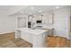 Open kitchen features white countertops, stainless appliances, and a central island with storage at 367 Broughton Dr., Myrtle Beach, SC 29579