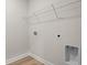 Bright laundry area features wire shelving and utility hookups for modern appliances at 367 Broughton Dr., Myrtle Beach, SC 29579