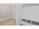 Hallway with a built-in bench, hooks, and storage leading into a room with flooring at 367 Broughton Dr., Myrtle Beach, SC 29579