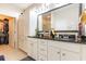 Bathroom featuring double sinks, granite countertop, and white cabinetry at 3672 White Wing Circle, Myrtle Beach, SC 29579