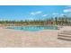 Large community pool with lounge chairs, tables, and a pergola for relaxation at 3672 White Wing Circle, Myrtle Beach, SC 29579
