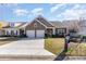 Charming single-Gathering home featuring a stone facade, two-car garage, and manicured lawn at 3672 White Wing Circle, Myrtle Beach, SC 29579