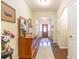 Inviting foyer with hardwood floors, decorative mirror, and arched doorway at 3672 White Wing Circle, Myrtle Beach, SC 29579