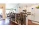 Open-concept kitchen featuring a breakfast bar with seating and white cabinets at 3672 White Wing Circle, Myrtle Beach, SC 29579