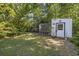 Backyard featuring a chicken coop, well-maintained lawn, trees and shrubs for animal lovers at 3772 Brown Bark Ln., Murrells Inlet, SC 29576