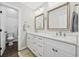 Bright bathroom featuring double sinks with white cabinets and modern fixtures, offering a clean and inviting space at 3772 Brown Bark Ln., Murrells Inlet, SC 29576