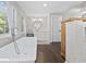 Bathroom with a freestanding tub, and a vanity and hardwood flooring at 3772 Brown Bark Ln., Murrells Inlet, SC 29576