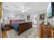 Bedroom with hardwood floors, ceiling fan, and vintage furnishings at 3772 Brown Bark Ln., Murrells Inlet, SC 29576