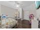 Cozy bedroom with a ceiling fan, charming bed frame and shelving to offer a personal space at 3772 Brown Bark Ln., Murrells Inlet, SC 29576