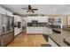 Bright kitchen featuring stainless steel appliances, granite countertops, and white cabinets at 3772 Brown Bark Ln., Murrells Inlet, SC 29576