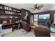 Cozy den with wood paneling, built in bookshelves, and decorative ceiling fan at 3772 Brown Bark Ln., Murrells Inlet, SC 29576