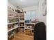 Well-organized walk-in pantry with plenty of shelving for storage at 3772 Brown Bark Ln., Murrells Inlet, SC 29576