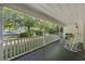 Relaxing porch with rocking chairs, overlooking the lush front yard and peaceful surroundings at 3772 Brown Bark Ln., Murrells Inlet, SC 29576