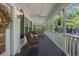 Covered porch featuring comfortable seating, ideal for enjoying the outdoors in style at 3772 Brown Bark Ln., Murrells Inlet, SC 29576
