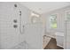 Modern bathroom featuring a shower with glass enclosure and a separate soaking tub at 3772 Brown Bark Ln., Murrells Inlet, SC 29576