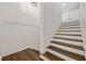 Staircase features white walls with dark stained wood steps at 3772 Brown Bark Ln., Murrells Inlet, SC 29576