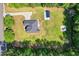 Bird's-eye view of a private backyard oasis with a well-maintained lawn, storage shed, and surrounding trees at 3926 Long Avenue Ext., Conway, SC 29527