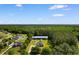 Charming home surrounded by mature trees and lush greenery with a serene woodland backdrop at 3926 Long Avenue Ext., Conway, SC 29527