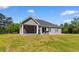 Backyard featuring an outdoor patio with a grill and screened in porch at 3926 Long Avenue Ext., Conway, SC 29527