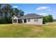 Backyard featuring an outdoor patio with a grill and screened in porch at 3926 Long Avenue Ext., Conway, SC 29527