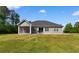 Spacious backyard featuring a patio and screened in porch at 3926 Long Avenue Ext., Conway, SC 29527