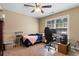 Neutral-toned bedroom with a bed, desk, chair, and window for natural light at 3926 Long Avenue Ext., Conway, SC 29527
