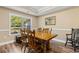Bright dining room with natural light and traditional wooden furniture set at 3926 Long Avenue Ext., Conway, SC 29527
