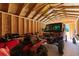 A spacious garage with exposed wood frame, filled with a red ATV, and a four-wheel drive utility vehicle at 3926 Long Avenue Ext., Conway, SC 29527