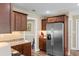Stylish kitchen with stainless steel refrigerator and abundant storage cabinets at 3926 Long Avenue Ext., Conway, SC 29527