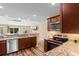 Open kitchen layout with granite countertops and stainless steel dishwasher at 3926 Long Avenue Ext., Conway, SC 29527