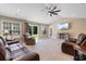 Spacious living room with plush seating, vaulted ceilings, and access to the backyard at 3926 Long Avenue Ext., Conway, SC 29527
