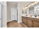 Bathroom showcasing double vanity, quartz countertop, framed mirrors, and decorative accents at 402 Sun Colony Blvd., Longs, SC 29568
