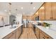 Modern kitchen featuring white countertops, wood cabinets, stainless steel appliances, and stylish pendant lighting at 402 Sun Colony Blvd., Longs, SC 29568
